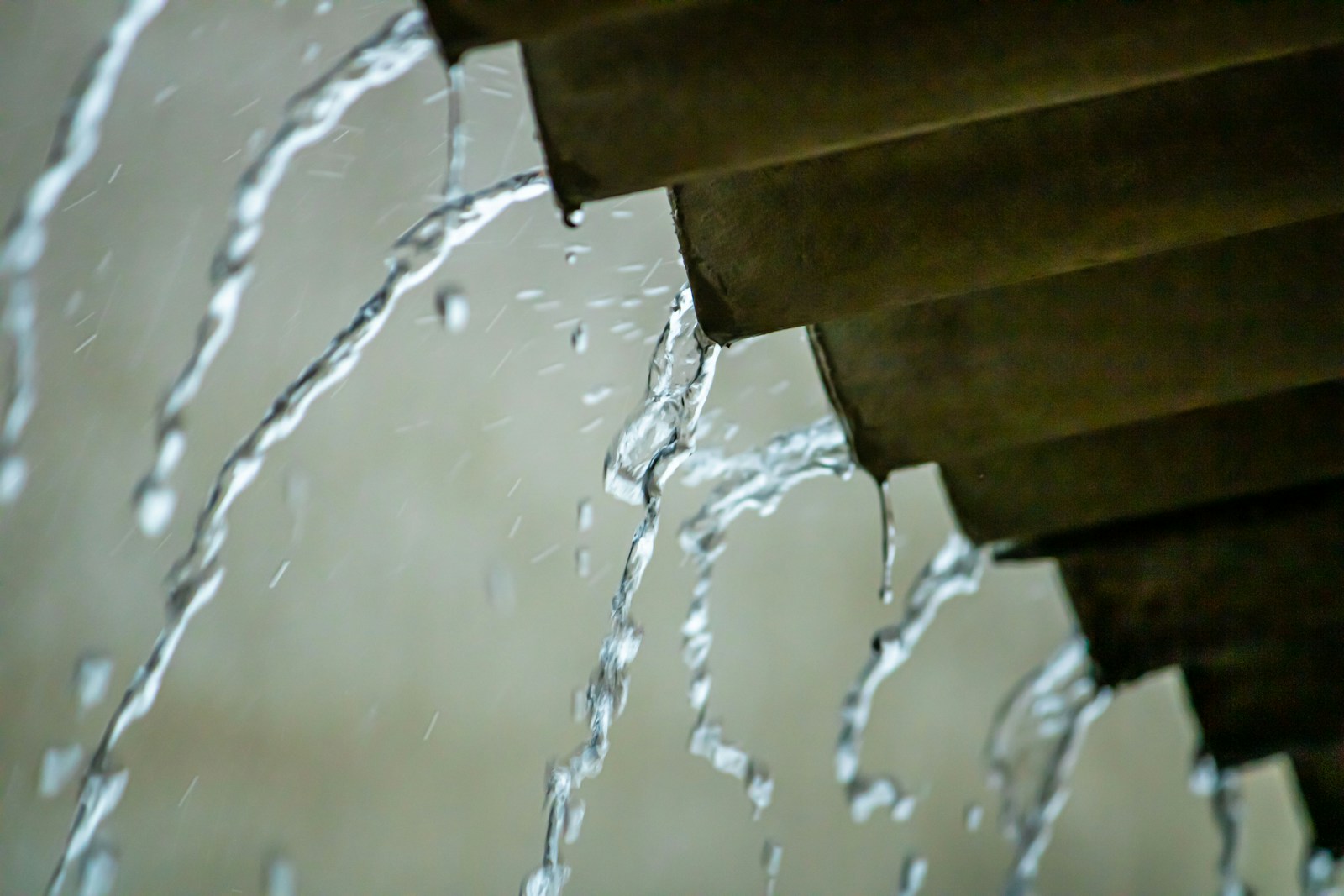 water pouring from a pipe into a pipe
